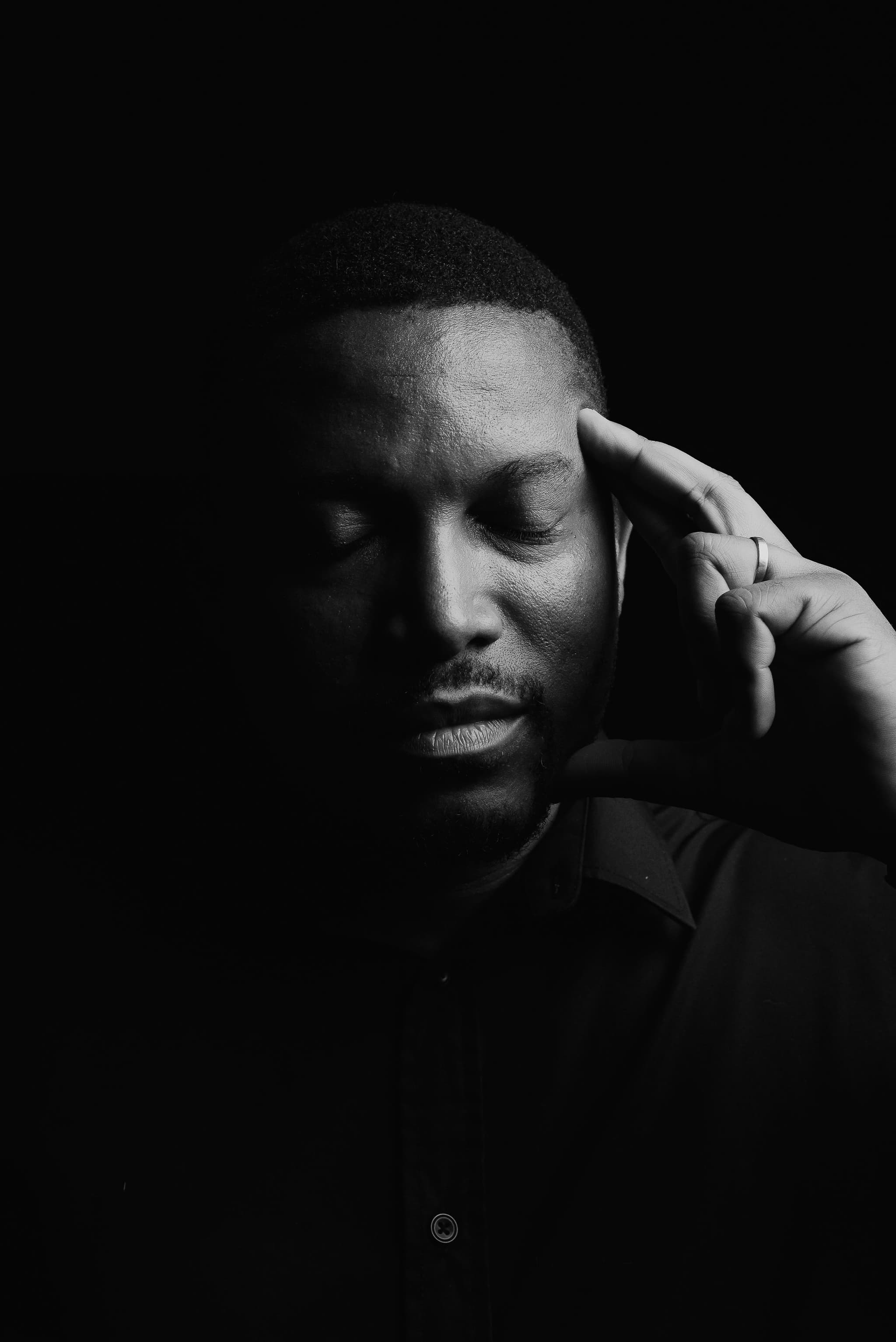 Black-and-white portrait — profile in shadow