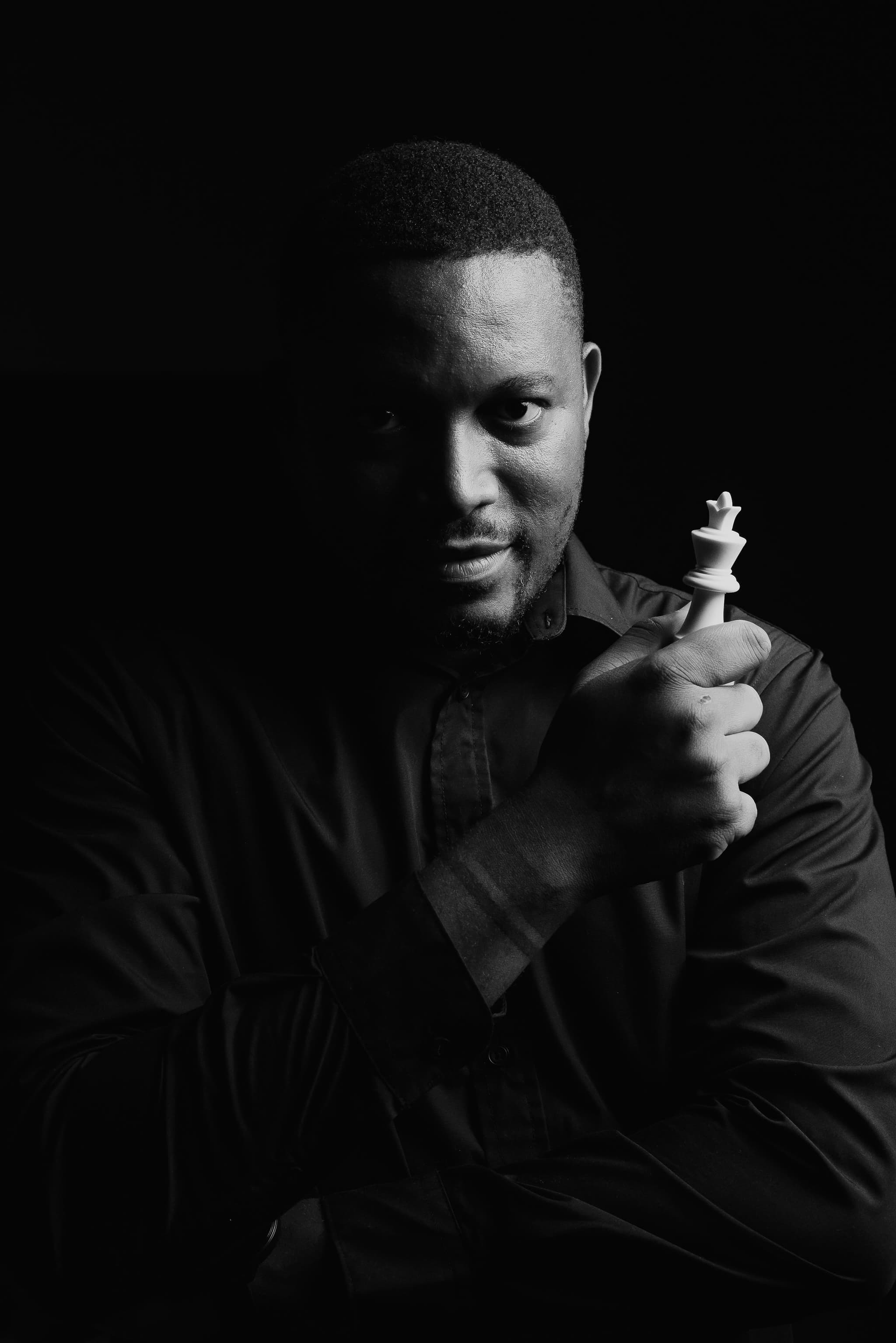 Black-and-white portrait — seated reflection